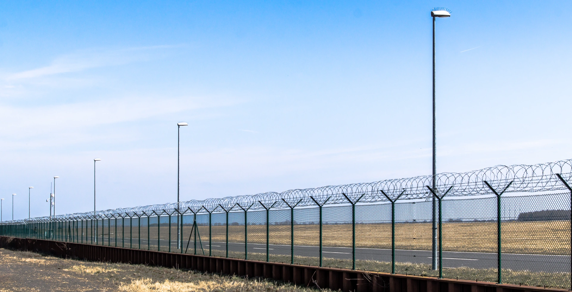 barbed-wire-fence-against-sky
