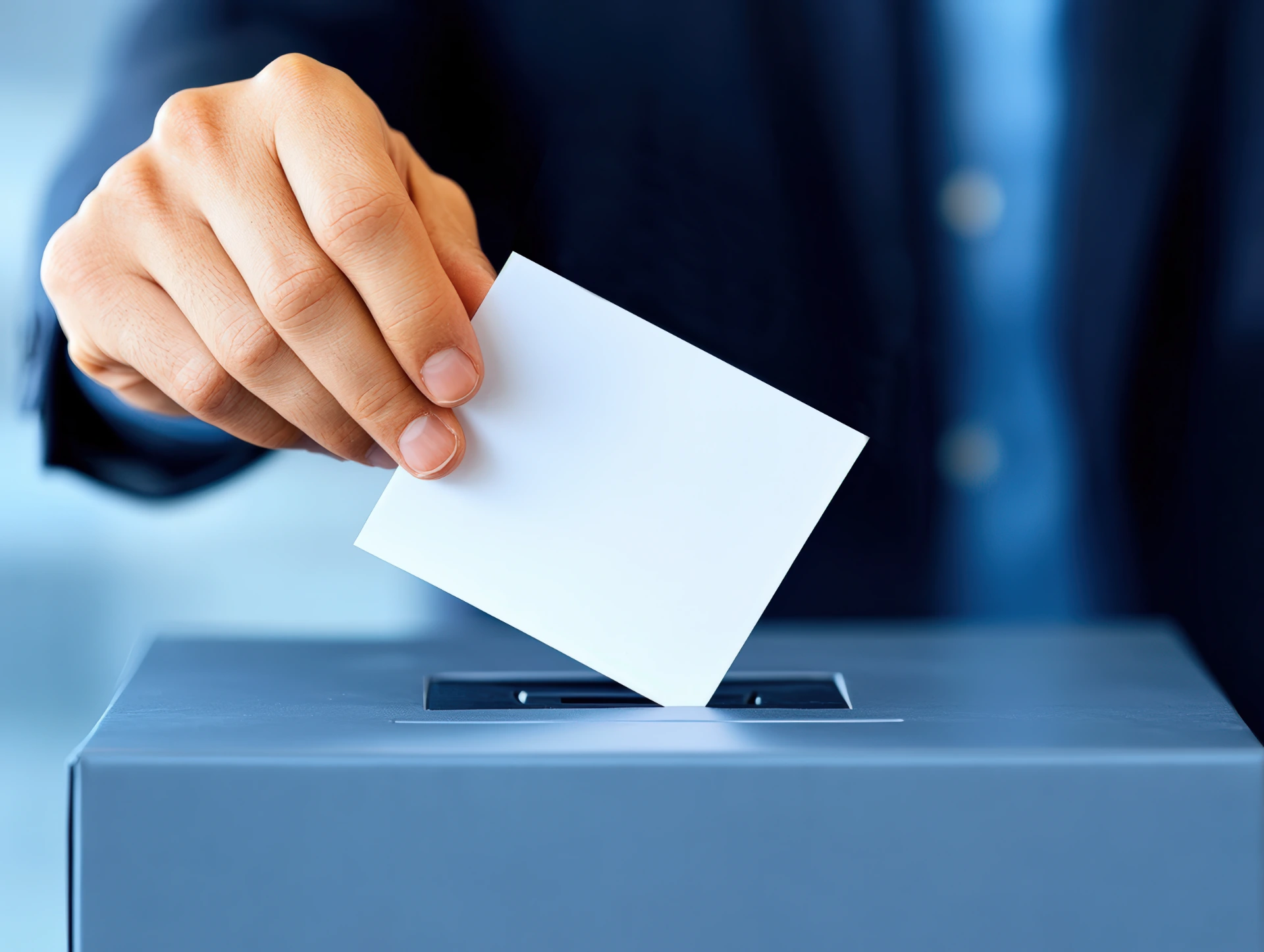 closeup-person-casting-vote-by-placing-ballot-into-voting-box-representing-democratic-process-elections